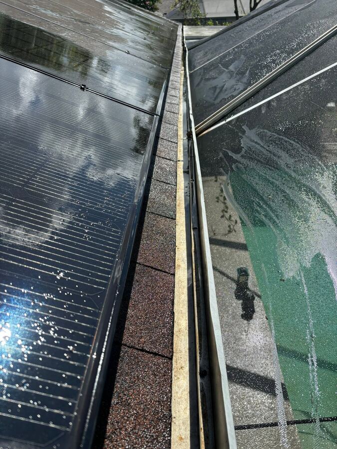Freshly cleaned pool cage screens and gutters after exterior cleaning service